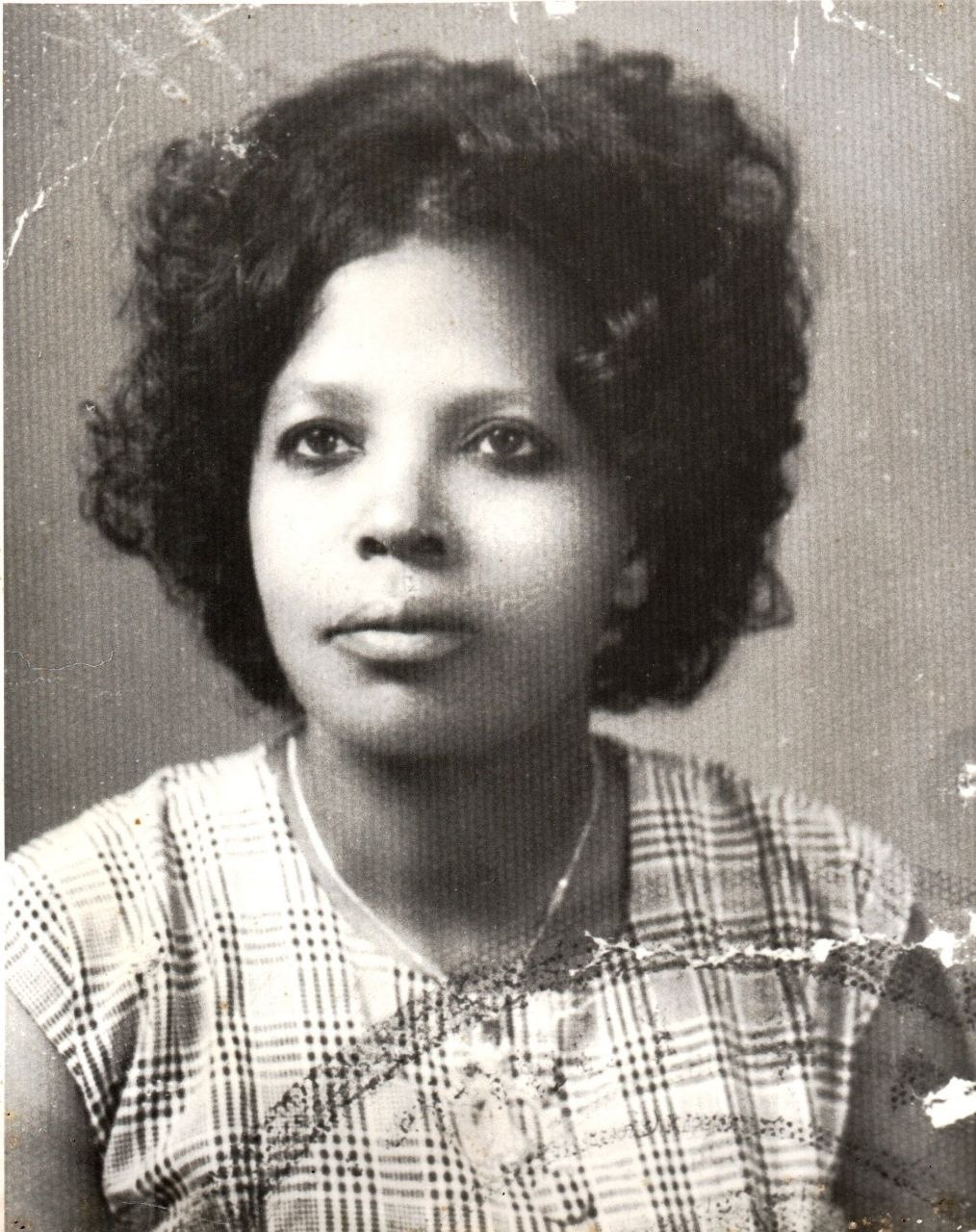 A black and white portrait of the founder's grandmother as a young woman